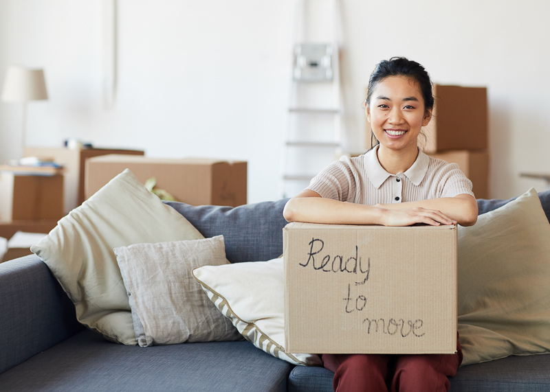 person holding box that says ready-to-buy